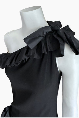 Close-up of Yves Saint Laurent Rive Gauche Fall 1982 shoulder bow and ruffled neckline detail